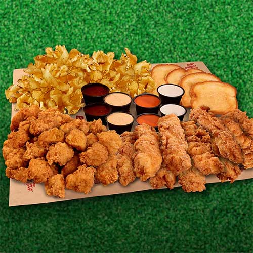 Huey Magoo’s Super Bowl 2026 party food featuring chicken wings, pizza, and game day deals for football fans and big game celebrations.