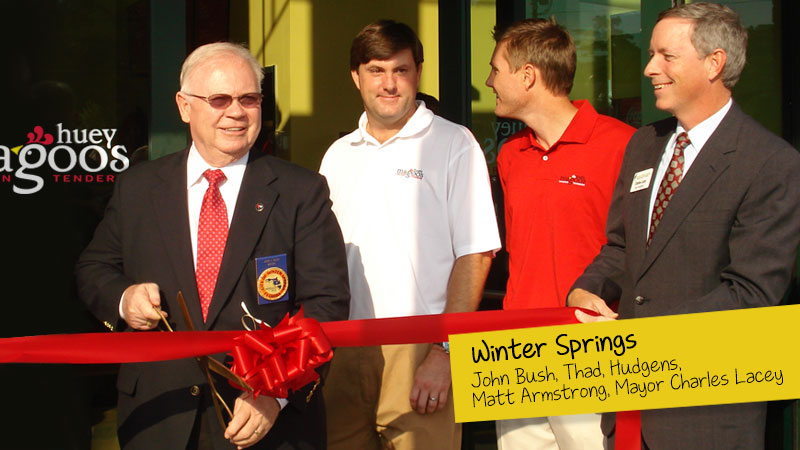 Grand Opening of Huey Magoo's in Winter Springs. John bush cutting the ribbon along with Thad Hudgens, Matt Armstrong and Mayor Charles Lacey